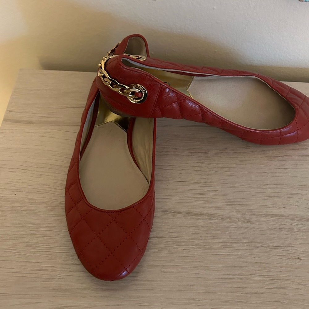 MK red Leather flats with gold chain.